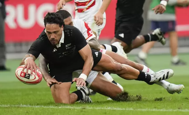 New Zealand's Billy Proctor scores a try during a rugby test match between the All Blacks and Japan at Nissan Stadium in Yokohama, near Tokyo, Saturday, Oct. 26, 2024. (AP Photo/Shuji Kajiyama)