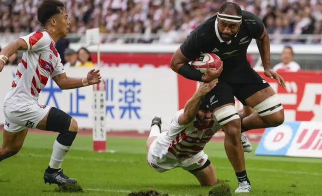 New Zealand's Patrick Tuipulotu runs to the try line during a rugby test match between the All Blacks and Japan at Nissan Stadium in Yokohama, near Tokyo, Saturday, Oct. 26, 2024. (AP Photo/Shuji Kajiyama)