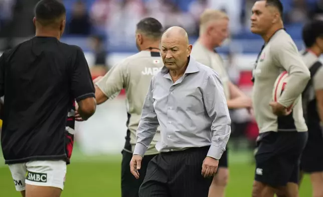 Japan coach Eddie Jones watches as his players warm up ahead of the rugby test match between the All Blacks and Japan at Nissan Stadium in Yokohama, near Tokyo, Saturday, Oct. 26, 2024. (AP Photo/Shuji Kajiyama)