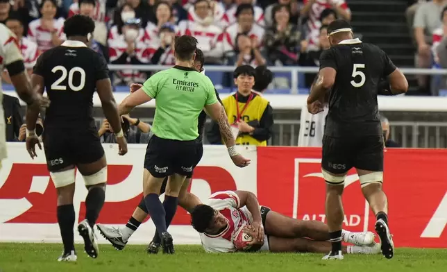 Japan's Opeti Helu scores his team's third try during a rugby test match between the All Blacks and Japan at Nissan Stadium in Yokohama, near Tokyo, Saturday, Oct. 26, 2024. (AP Photo/Shuji Kajiyama)