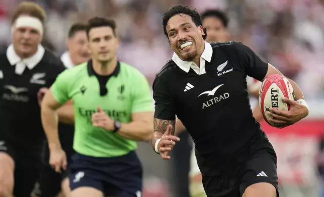 New Zealand's Billy Proctor makes a run during a rugby test match between the All Blacks and Japan at Nissan Stadium in Yokohama, near Tokyo, Saturday, Oct. 26, 2024. (AP Photo/Shuji Kajiyama)