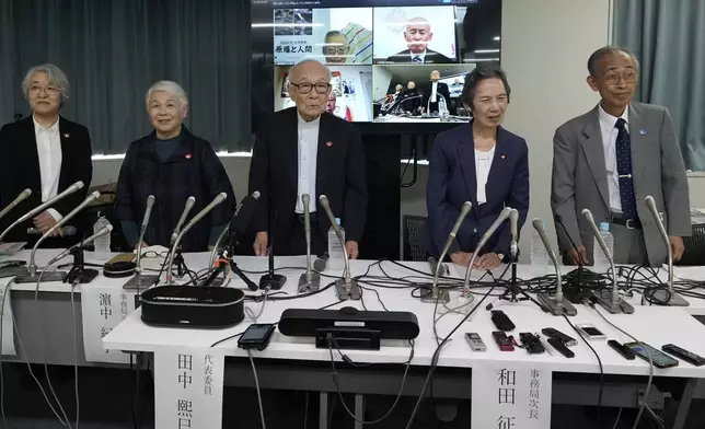 Terumi Tanaka, center, co-chairperson of Nihon Hidankyo and other senior members attend a press conference in Tokyo, Saturday, Oct. 12, 2024, a day after Nihon Hidankyo, an organization of survivors of the two U.S. atomic bombings, won the Nobel Peace Prize. Other members from second left to right, assistant Secretary Generals Toshiko Hamanaka, Masako Wada, and Jiro Hamasumi.(AP Photo/Hiro Komae)