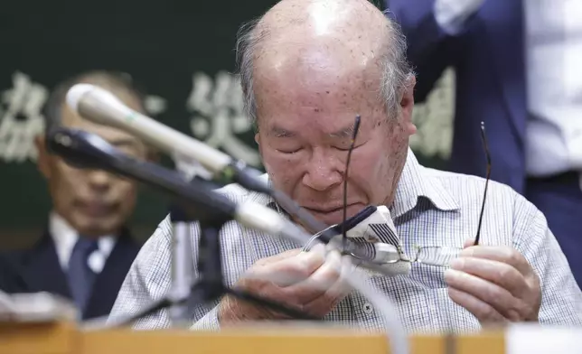 Shigemitsu Tanaka, the chairman of Nagasaki Atomic bomb Survivors Council, cries during a press conference, in Nagasaki, western Japan, Friday, Oct. 11, 2024, after Nihon Hidankyo, or the Japan Confederation of A- and H-Bomb Sufferers Organizations, won the Nobel Peace Prize.(Kyodo News via AP)