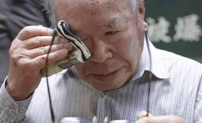 Shigemitsu Tanaka, the chairman of Nagasaki Atomic bomb Survivors Council, cries during a press conference, in Nagasaki, western Japan, Friday, Oct. 11, 2024, after Nihon Hidankyo, or the Japan Confederation of A- and H-Bomb Sufferers Organizations, won the Nobel Peace Prize.(Kyodo News via AP)