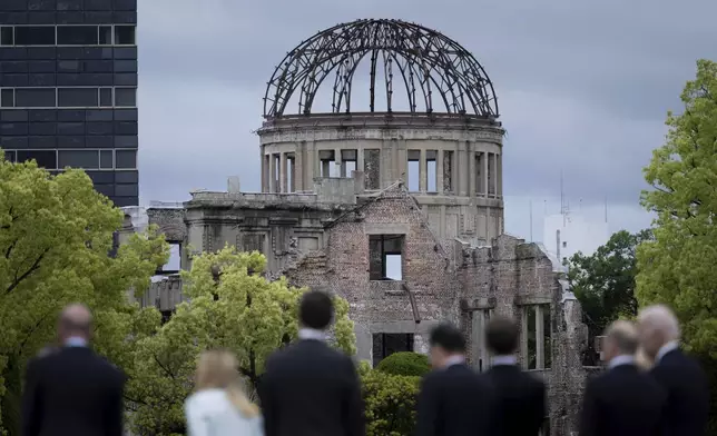 FILE - Leaders of the Group of Seven nations' meetings walk before the Atomic Bomb Dome during a visit to the Peace Memorial Park as part of the G7 Leaders' Summit in Hiroshima, western Japan Friday, May 19, 2023. (Brendan Smialowski/Pool Photo via AP, File)