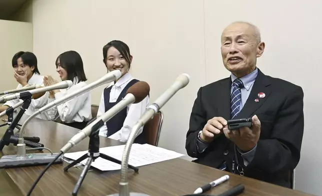 Toshiyuki Mimaki, right, president of Nihon Hidankyo, or the Japan Confederation of A- and H-Bomb Sufferers Organizations, speaks to media members in Hiroshima, Japan, Friday, Oct. 11, 2024, as he reacts to Ninon Hidankyo's winning the Nobel Peace Prize. (Moe Sasaki/Kyodo News via AP)