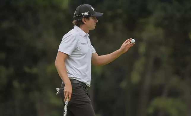 Nico Echavarria of Colombia acknowledges the fans after putting on the 17th green in the third round of the PGA Tour Zozo Championship at the Narashino Country Club in Inzai on the outskirts of Tokyo, Saturday, Oct. 26, 2024. (AP Photo/Tomohiro Ohsumi)