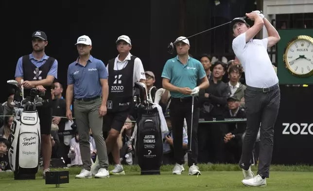 Nico Echavarria of Colombia, right, hits his tee shot on the 18th hole in the third round of the PGA Tour Zozo Championship at the Narashino Country Club in Inzai on the outskirts of Tokyo, Saturday, Oct. 26, 2024. (AP Photo/Tomohiro Ohsumi)