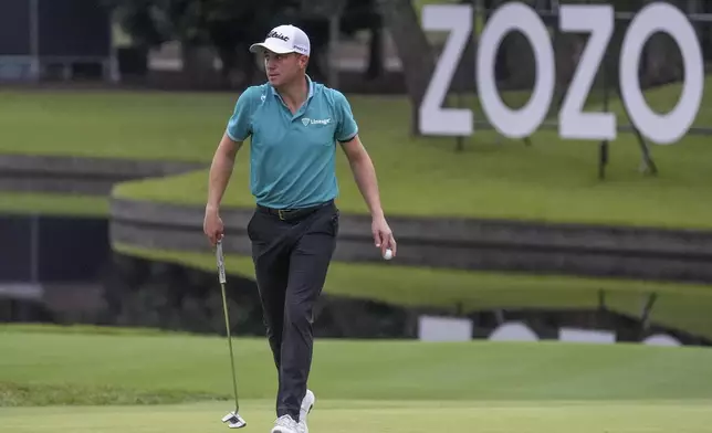 Justin Thomas of the United States walks infront of zozo logo on the 16th hole in the third round of the PGA Tour Zozo Championship at the Narashino Country Club in Inzai on the outskirts of Tokyo, Saturday, Oct. 26, 2024. (AP Photo/Tomohiro Ohsumi)