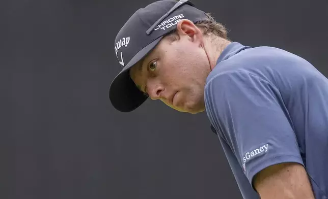 Max Greyserman of the United States lines up a putt on the 15th green in the third round of the PGA Tour Zozo Championship at the Narashino Country Club in Inzai on the outskirts of Tokyo, Saturday, Oct. 26, 2024. (AP Photo/Tomohiro Ohsumi)