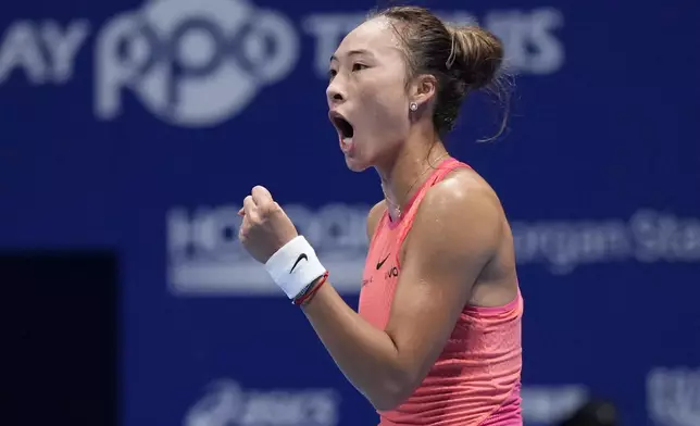 China's Zheng Qinwen reacts after winning a point against Sofia Kenin of the United States during the final match of the Pan Pacific Open women's tennis tournament at Ariake Coliseum, in Tokyo, Sunday, Oct. 27, 2024. (AP Photo/Eugene Hoshiko)