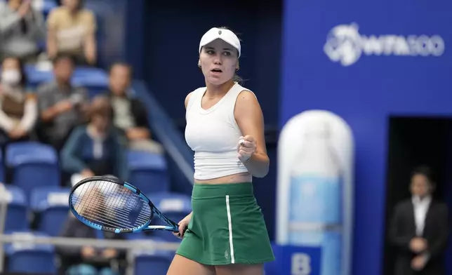 Sofia Kenin of the United States reacts after winning her semifinal match against Britain's Katie Boulter in the Pan Pacific Open women's tennis tournament at Ariake Coliseum, in Tokyo, Saturday, Oct. 26, 2024. (AP Photo/Eugene Hoshiko)