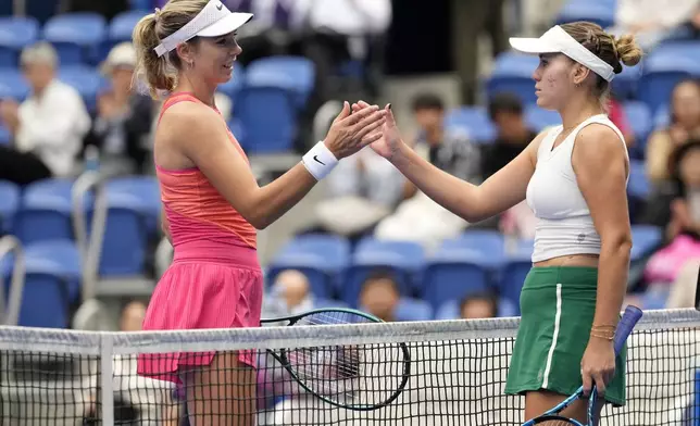 Sofia Kenin of the United States, right, and Britain's Katie Boulter greet each other after Sofia won the semifinal match of the Pan Pacific Open women's tennis tournament at Ariake Coliseum, in Tokyo, Saturday, Oct. 26, 2024. (AP Photo/Eugene Hoshiko)