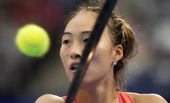 China's Zheng Qinwen plays against Russia's Diana Shnaider during the second semifinal match of the Pan Pacific Open women's tennis tournament at Ariake Coliseum, in Tokyo, Saturday, Oct. 26, 2024. (AP Photo/Eugene Hoshiko)