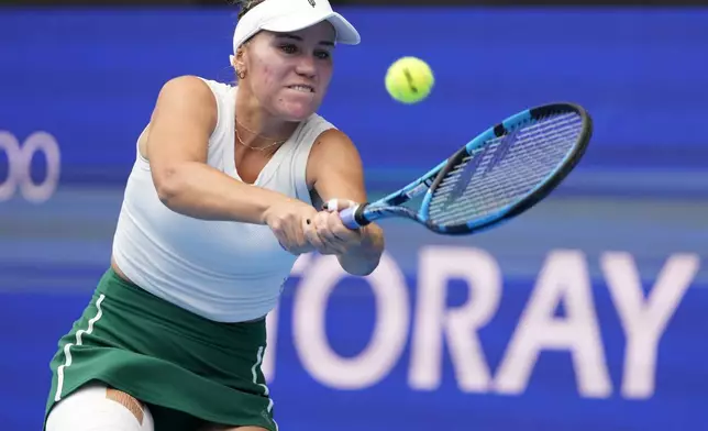 Sofia Kenin of the United States returns a shot against China's Zheng Qinwen during the final match of the Pan Pacific Open women's tennis tournament at Ariake Coliseum, in Tokyo, Sunday, Oct. 27, 2024. (AP Photo/Eugene Hoshiko)