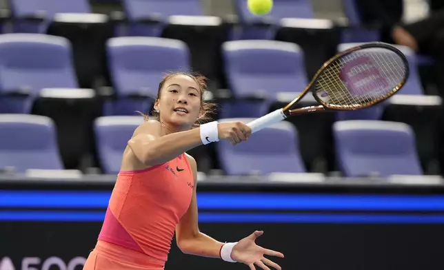 China's Zheng Qinwen plays against Russia's Diana Shnaider during the second semifinal match of the Pan Pacific Open women's tennis tournament at Ariake Coliseum, in Tokyo, Saturday, Oct. 26, 2024. (AP Photo/Eugene Hoshiko)