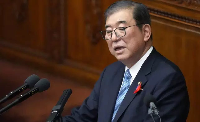 Japanese Prime Minister Shigeru Ishiba delivers his first policy speech during a Diet session at the Lower House of the Parliament Friday, Oct. 4, 2024, in Tokyo. (AP Photo/Eugene Hoshiko)