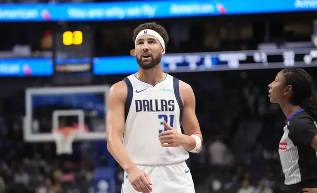 Dallas Mavericks guard Klay Thompson (31) looks up from the court during the first half of a preseason NBA basketball game against the Utah Jazz, Thursday, Oct. 10, 2024, in Dallas. (AP Photo/LM Otero)