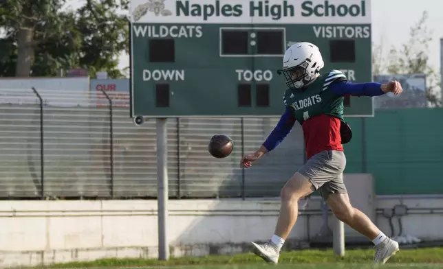 Wildcats team Quarterback Camden Kasparek practices during a training session at the football field of the U.S. Naval Support – Site in Gricignano di Aversa, southern Italy, Tuesday, Oct. 29, 2024. (AP Photo/Gregorio Borgia)