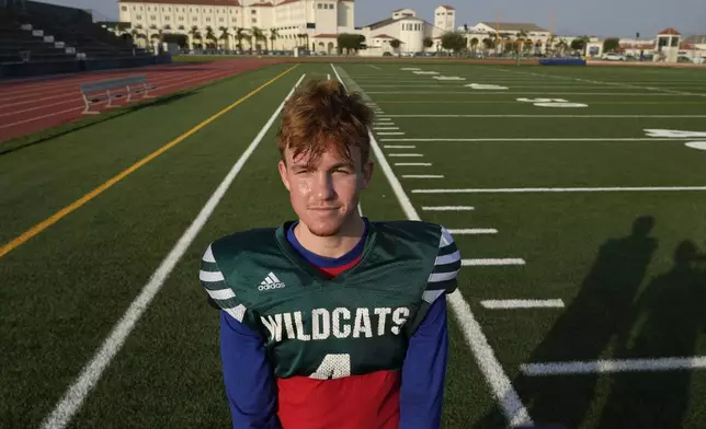 Wildcats team Quarterback Camden Kasparek is interviewed by The Associated Press at the football field of the U.S. Naval Support – Site in Gricignano di Aversa, southern Italy, Tuesday, Oct. 29, 2024. (AP Photo/Gregorio Borgia)