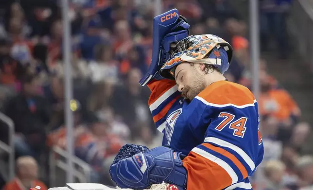 Edmonton Oilers goalie Stuart Skinner (74) reacts after a Winnipeg Jets goal during the first period of an NHL hockey game, Wednesday, Oct. 9, 2024 in Edmonton, Alberta. (Amber Bracken/Canadian Press via AP)