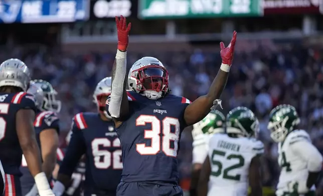 New England Patriots running back Rhamondre Stevenson (38) celebrates after his touchdown in the second half of an NFL football game against the New York Jets, Sunday, Oct. 27, 2024, in Foxborough, Mass. (AP Photo/Charles Krupa)