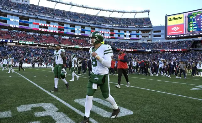 New York Jets quarterback Aaron Rodgers (8) walks off the field following an NFL football game against the New England Patriots, Sunday, Oct. 27, 2024, in Foxborough, Mass. (AP Photo/Charles Krupa)