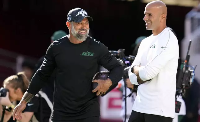 FILE - New York Jets head coach Robert Saleh, right, talks with defensive coordinator Jeff Ulbrich before an NFL football game against the San Francisco 49ers in Santa Clara, Calif., Monday, Sept. 9, 2024. (AP Photo/Godofredo A. Vásquez, File)