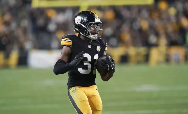 Pittsburgh Steelers cornerback Beanie Bishop Jr. (31) returns an interception in the second half of an NFL football game against the New York Jets in Pittsburgh, Sunday, Oct. 20, 2024. (AP Photo/Matt Freed)