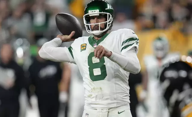 New York Jets quarterback Aaron Rodgers (8) passes in the first half of an NFL football game against the Pittsburgh Steelers in Pittsburgh, Sunday, Oct. 20, 2024. (AP Photo/Gene J. Puskar)