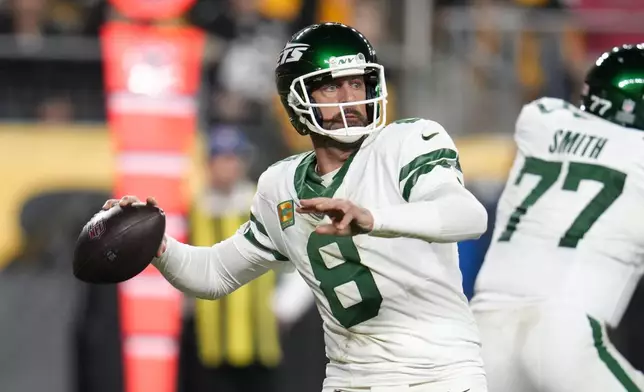 New York Jets quarterback Aaron Rodgers (8) passes in the first half of an NFL football game in Pittsburgh, Sunday, Oct. 20, 2024. (AP Photo/Gene J. Puskar)