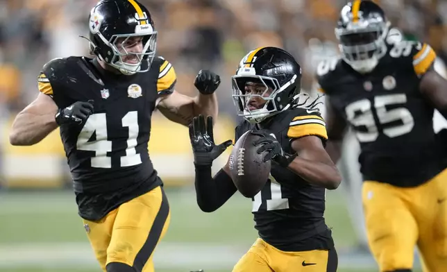 Pittsburgh Steelers cornerback Beanie Bishop Jr. (31) celebrates his interception with linebacker Payton Wilson (41) in the first half of an NFL football game against the New York Jets in Pittsburgh, Sunday, Oct. 20, 2024. (AP Photo/Gene J. Puskar)