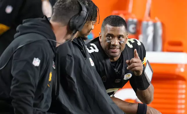 Pittsburgh Steelers quarterback Russell Wilson (3) talks on the bench in the second half of an NFL football game against the New York Jets in Pittsburgh, Sunday, Oct. 20, 2024. (AP Photo/Gene J. Puskar)