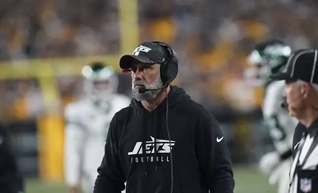 New York Jets head coach Jeff Ulbrich watches fro the sideline in the second half of an NFL football game against the Pittsburgh Steelers in Pittsburgh, Sunday, Oct. 20, 2024. (AP Photo/Matt Freed)