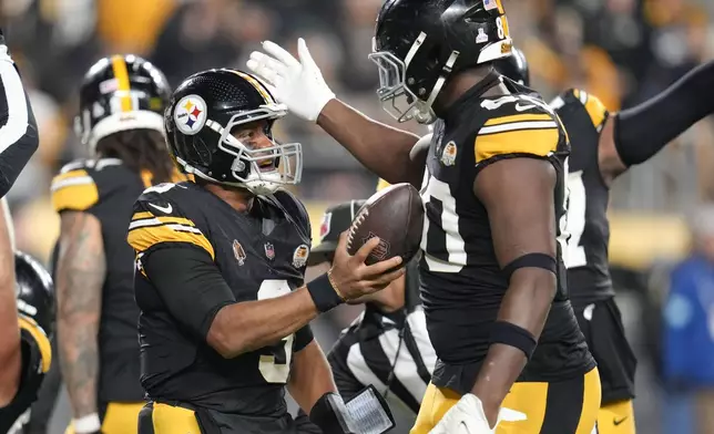 Pittsburgh Steelers quarterback Russell Wilson (3) celebrates his touchdown in the second half of an NFL football game against the New York Jets in Pittsburgh, Sunday, Oct. 20, 2024. (AP Photo/Gene J. Puskar)