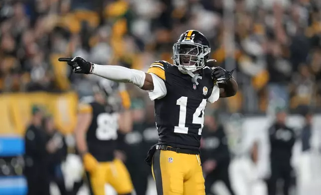 Pittsburgh Steelers wide receiver George Pickens (14) celebrates a first down catch in the second half of an NFL football game against the New York Jets in Pittsburgh, Sunday, Oct. 20, 2024. (AP Photo/Gene J. Puskar)