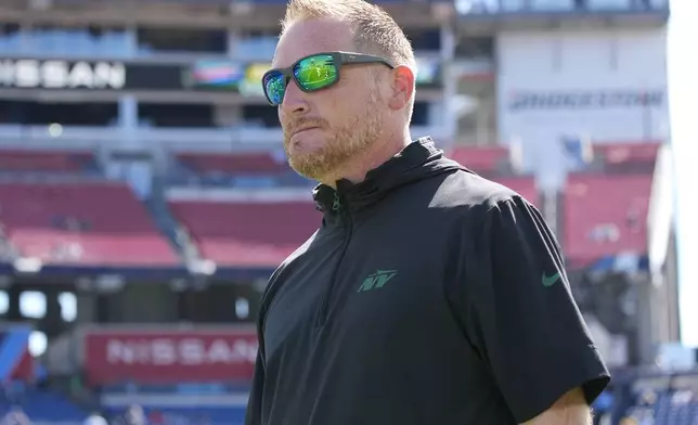 FILE - New York Jets passing game coordinator Todd Downing walks the field before an NFL football game against the Tennessee Titans, Sunday, Sept. 15, 2024, in Nashville, Tenn. (AP Photo/George Walker IV, File)