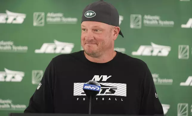 FILE - New York Jets' offensive coordinator Nathaniel Hackett talks to reporters before a practice at the NFL football team's training facility in Florham Park, N.J., Tuesday, July 30, 2024. (AP Photo/Seth Wenig, File)