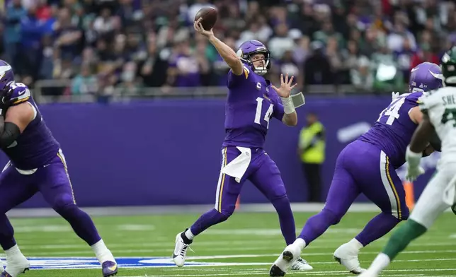 Minnesota Vikings quarterback Sam Darnold throws during the first half of an NFL football game against the New York Jets, Sunday, Oct. 6, 2024, at the Tottenham Hotspur stadium in London. (AP Photo/Kirsty Wigglesworth)