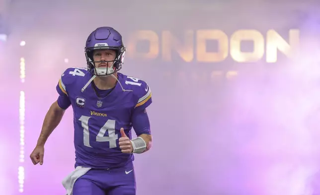 Minnesota Vikings quarterback Sam Darnold is introduced before an NFL football game against the New York Jets, Sunday, Oct. 6, 2024, at the Tottenham Hotspur stadium in London. (AP Photo/Ian Walton)