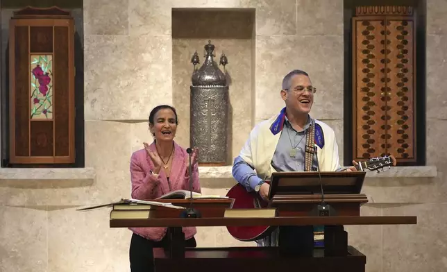 Gayle Pomerantz, left, senior rabbi at Temple Beth Sholom, and Cantor Juval Porat sing during a Shabbat service, Friday, Sept. 27, 2024, in Miami Beach, Fla. (AP Photo/Wilfredo Lee)