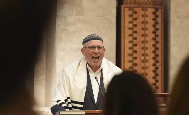 Rabbi Robert A. Davis speaks during a Shabbat service, Friday, Sept. 27, 2024, at Temple Beth Sholom in Miami Beach, Fla. (AP Photo/Wilfredo Lee)