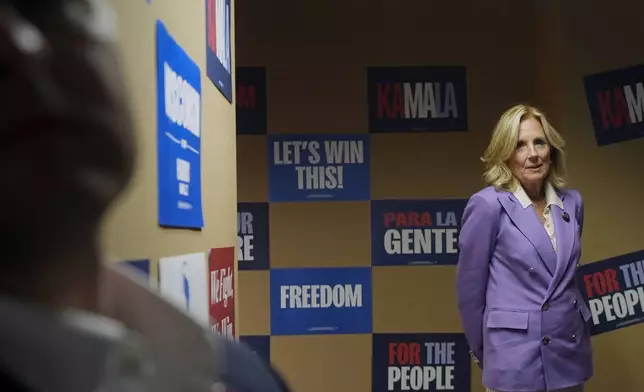 First lady Jill Biden waits to be introduced during a campaign stop Monday, Oct. 14, 2024, in Madison, Wis. (AP Photo/Morry Gash)