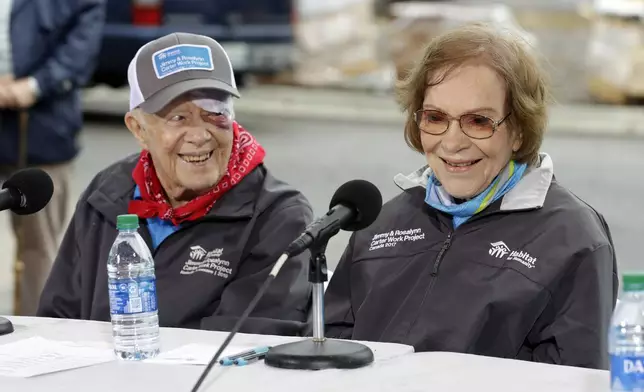 FILE - Former President Jimmy Carter and former First Lady Rosalynn Carter answer questions during a news conference at a Habitat for Humanity project, Oct. 7, 2019, in Nashville, Tenn. (AP Photo/Mark Humphrey, File)