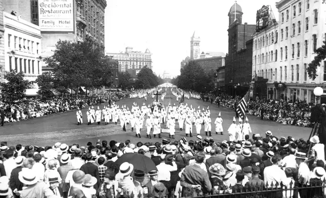 FILE - The Ku Klux Klan marches down Pennsylvania Ave. past the Treasury Building in Washington D.C. in 1925. (AP Photo, File)