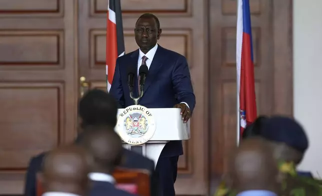 Kenya's President William Ruto, speaks during a joint press conference with Haiti Prime Minister Garry Conille at State House in Nairobi, Kenya, Friday, Oct. 11, 2024. (AP Photo/Brian Inganga)