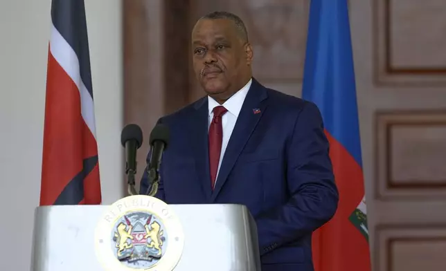 Haiti Prime Minister Garry Conille, speaks during a joint press conference with Kenya's President William Ruto at State House in Nairobi, Kenya, Friday, Oct. 11, 2024. (AP Photo/Brian Inganga)