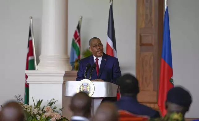 Haiti Prime Minister Garry Conille, speaks during a joint press conference with Kenya's President William Ruto at State House in Nairobi, Kenya, Friday, Oct. 11, 2024. (AP Photo/Brian Inganga)