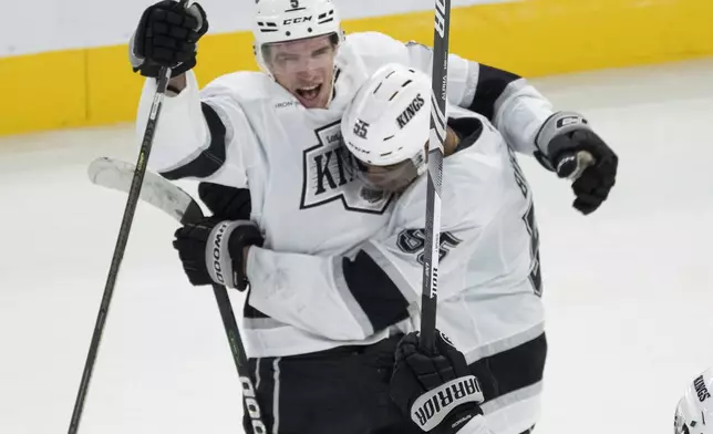 Los Angeles Kings Andreas Englund (5) celebrates with teammate Quinton Byfield (55) after scoring a goal during the third period of an NHL hockey game against the Montreal Canadiens, Thursday, Oct. 17, 2024 in Montreal. (Ryan Remiorz/The Canadian Press via AP)