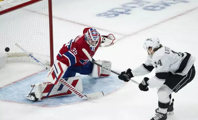 Montreal Canadiens goaltender Sam Montembeault (35) stops Los Angeles Kings' Alex Laferriere (14) on a breakaway during second-period NHL hockey game action Thursday, Oct. 17, 2024, in Montreal. (Ryan Remiorz/The Canadian Press via AP)